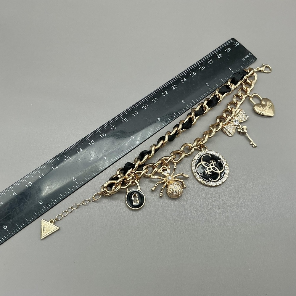 Guess Bracelet Gold Tone Black Enamel Crystal Spider Logo Charm‎ Womens Fashion - Picture 8 of 8